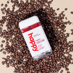 magical medium roast instant coffee container on a bed of coffee beans. 