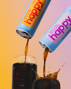 Two cans of 'happy' Cold Brew coffees being poured into a glass with a colorful background.